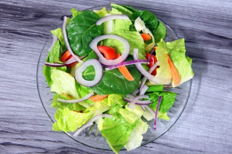 tossed salad on a wooden background