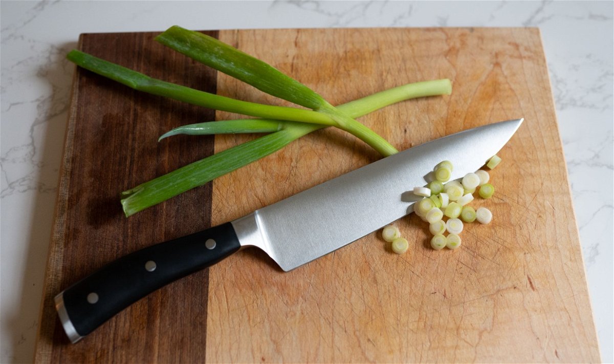 wusthof-classic-ikon-chef-knife-green-onions